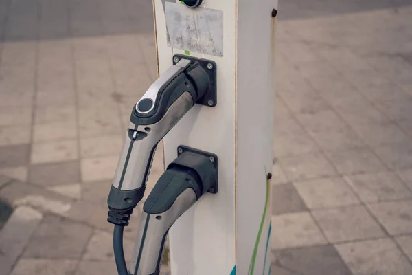 Charging station for electric car. Vehicle and infrastructure-side connectors and sockets for AC and DC charging. EV fuel for advanced hybrid.