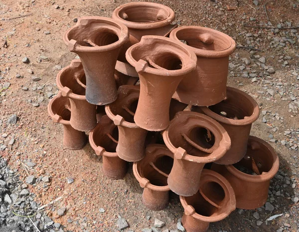 Double clay stoves piled on top of each other near a main road to sell in Sri Lanka.