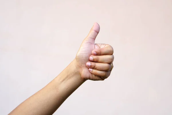 stock image Asian woman's hand raising thumbs as a sign of greatness