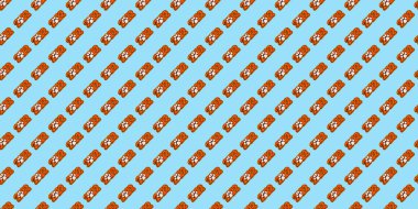 Kusursuz desenli zencefilli kurabiyeler, açık mavi pastel arka planda turuncu jöleli kaplan renklerinde numaralar şeklinde..