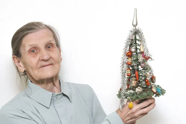 Lonely Old Elderly Woman Holds Small Christmas Tree Decorated Glass — Photo