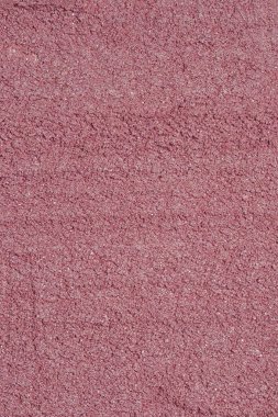 Pembe tozun dokusu. Tam çerçevede kuru boyanın soyut arkaplanı.