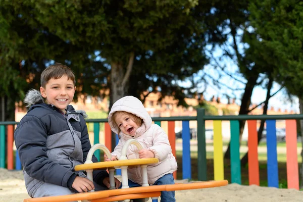 Portrait Girl Boy Sitting Swing Playground Stock Photo