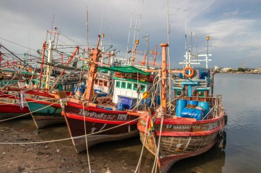 Thai fishing boats at a pier or wharf in Thailand Southeast Asia