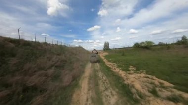 FPV flight pursuit of a military armoured personnel carrier at training