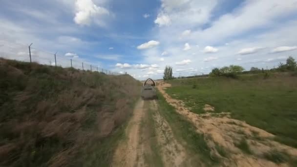 FPV flight pursuit of a military armoured personnel carrier at training — 图库视频影像