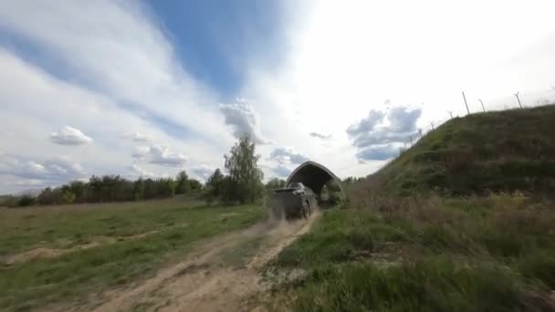 FPV flight pursuit of a military armoured personnel carrier at training — 图库视频影像