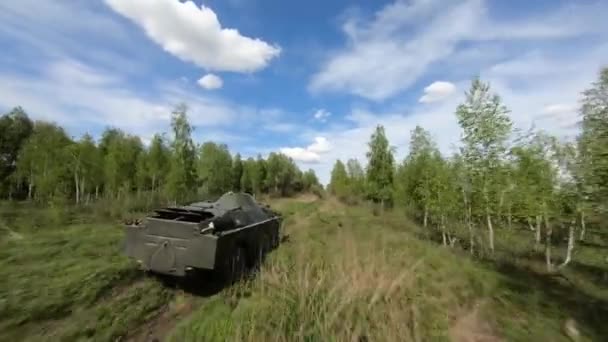 FPV flight pursuit of a military armoured personnel carrier at training — 图库视频影像