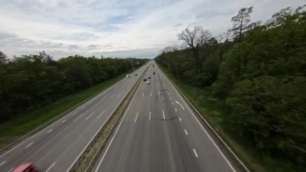 FPV flight along a nearly empty highway passing through the forest — Αρχείο Βίντεο