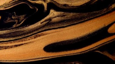 Akışkan sanat video akışı efekti çiziyor. Sıvı boya, sıçrama ve girdapla karıştırılmış sanat eserleri. Soyut altın arkaplan.