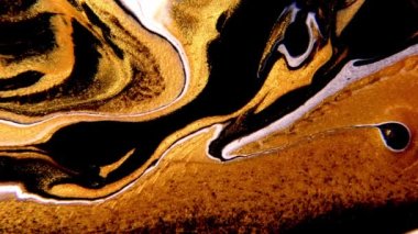 Akışkan sanat video akışı efekti çiziyor. Sıvı boya, sıçrama ve girdapla karıştırılmış sanat eserleri. Soyut altın arkaplan.