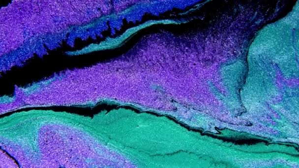 Peinture abstraite mélangeant l'encre bleu néon vert et violet. Liquide coloré incroyable fond organique. — Video