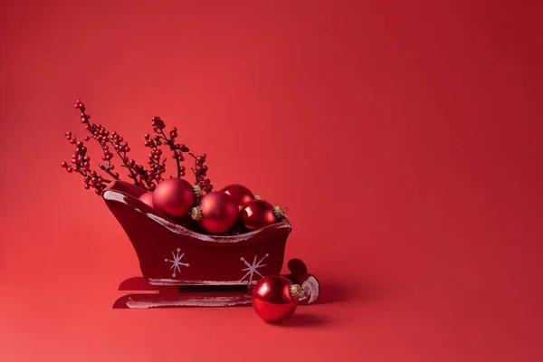 Red Santa Sleigh Baubles Red Background Christmas Concept Copy Space — Stok Foto