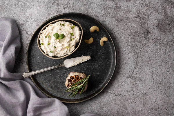 Plate Cashew Cheese Baked Garlic Gray Background Fermented Nut Spread Stock Picture