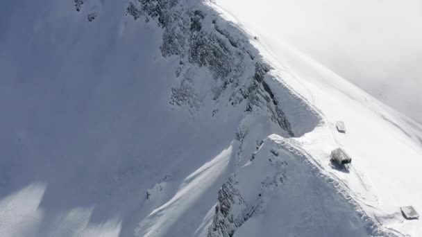 Flight over winter snowy wilderness mountain ridge with valley — Stock Video