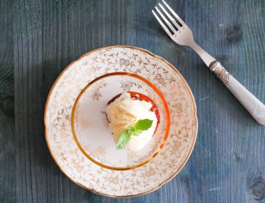 Caramelized peach with sugar and butter, vanilla ice cream and mints