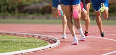 Athletics people running on the track field. Running a race on a track for sports competition and winning