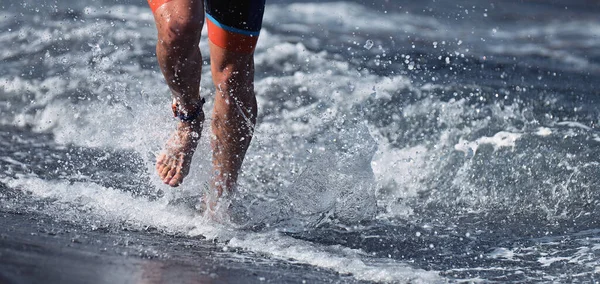 Triathlete Swimmer Running Out Ocean Finishing Swim Race Fit Man — Fotografia de Stock