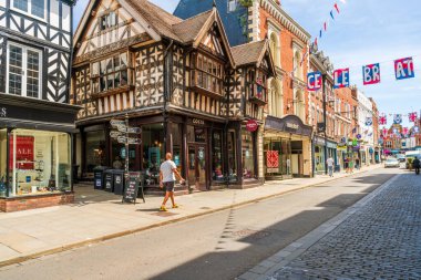 SHREWSBURY, UK - JULY 11, 2022: Street view in Shrewsbury, the county town of Shropshire. It sits inside a loop of the River Severn, and its Tudor centre is lined with half-timbered houses.