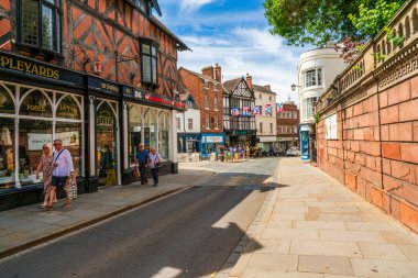 SHREWSBURY, UK - JULY 11, 2022: Street view in Shrewsbury, the county town of Shropshire. It sits inside a loop of the River Severn, and its Tudor centre is lined with half-timbered houses.