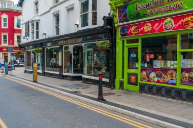 ABERYSTWYTH, WALES, UK - JULY 06, 2022: Street view in Aberystwyth, a university town and community in the historic county of Cardiganshire in Wales