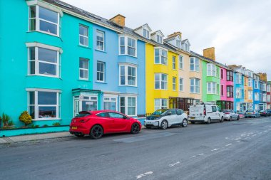 ABERYSTWYTH, WALES, UK - JULY 06, 2022: A row of colorful houses in Aberystwyth, a university town and community in the historic county of Cardiganshire in Wales