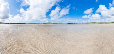 Wide panoramic view of Ardriol beach in Uig Bay on Isle of Lewis, Scotland, UK
