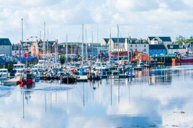 STORNOWAY, ISLE OF LEWIS, SCOTLAND, AUGUST 05, 2022: View of harbour in Stornoway, the main town of the Western Isles and the capital of Lewis and Harris in Scotland.