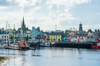 STORNOWAY, ISLE OF LEWIS, SCOTLAND, AUGUST 05, 2022: View of harbour in Stornoway, the main town of the Western Isles and the capital of Lewis and Harris in Scotland.