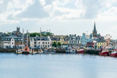 STORNOWAY, ISLE OF LEWIS, SCOTLAND, AUGUST 05, 2022: View of harbour in Stornoway, the main town of the Western Isles and the capital of Lewis and Harris in Scotland.