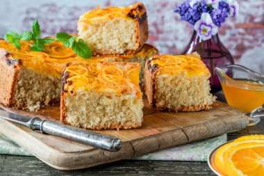 Orange and almond upside-down cake with orange syrup