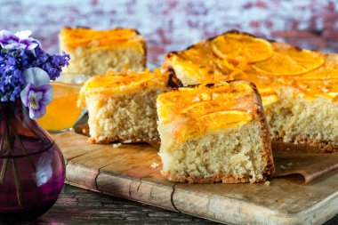 Orange and almond upside-down cake with orange syrup