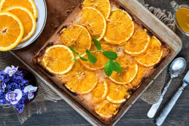 Orange and almond upside-down cake with orange syrup