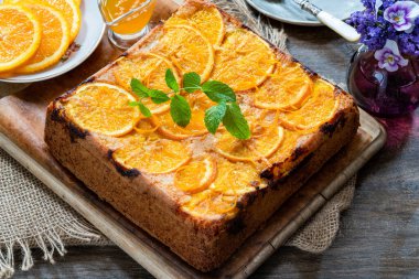 Orange and almond upside-down cake with orange syrup