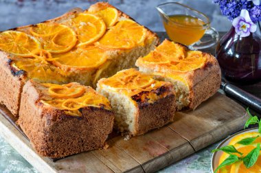 Orange and almond upside-down cake with orange syrup