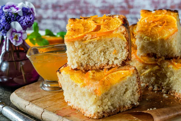 Orange and almond upside-down cake with orange syrup