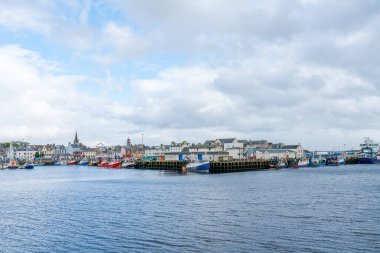 STORNOWAY, ISLE OF LEWIS, SCOTLAND, AUGUST 02, 2022: View of harbour in Stornoway, the main town of the Western Isles and the capital of Lewis and Harris in Scotland.