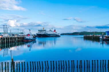 STORNOWAY, ISLE OF LEWIS, SCOTLAND, AUGUST 04, 2022: View of the harbour in Stornoway, the main town of the Western Isles and the capital of Lewis and Harris in Scotland.