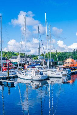 STORNOWAY, ISLE OF LEWIS, SCOTLAND, AUGUST 05, 2022: View of the harbour in Stornoway, the main town of the Western Isles and the capital of Lewis and Harris in Scotland.