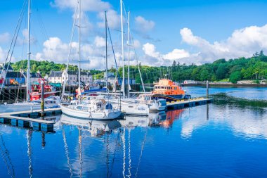 STORNOWAY, ISLE OF LEWIS, SCOTLAND, AUGUST 05, 2022: View of the harbour in Stornoway, the main town of the Western Isles and the capital of Lewis and Harris in Scotland.