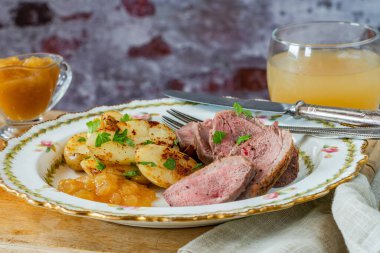 Roasted dack breast with fried potatoes and apple sauce
