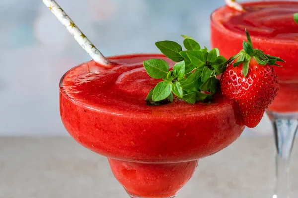 Frozen strawberry daiquiri with white rum garnished with fresh fruit