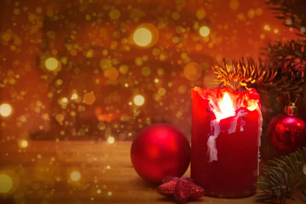 Christmas background with burning candle and fir tree branch — Stock Photo, Image