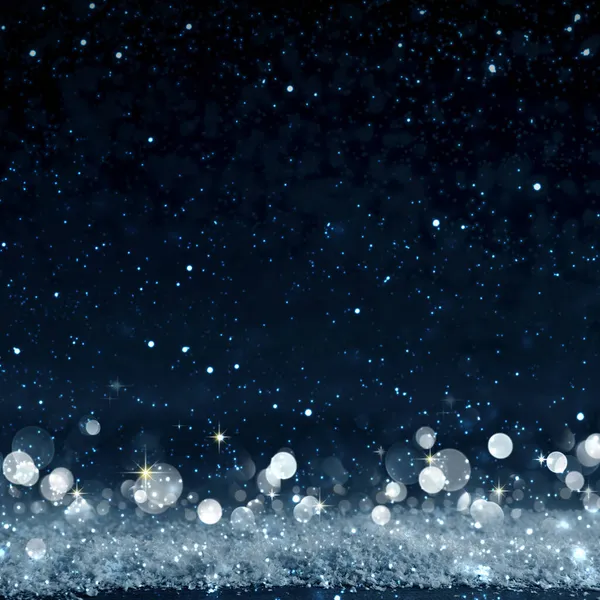 Karácsonyi háttér elmosódott bokeh és csillagok ég. — Stock Fotó