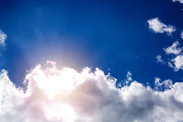 Blue sky with sun and beautiful white clouds. — Stock Photo, Image