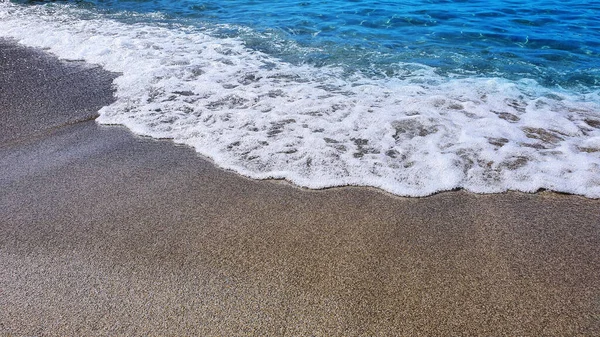 Abstrakter Sand vom Strand und weicher Wellenhintergrund. — Stockfoto