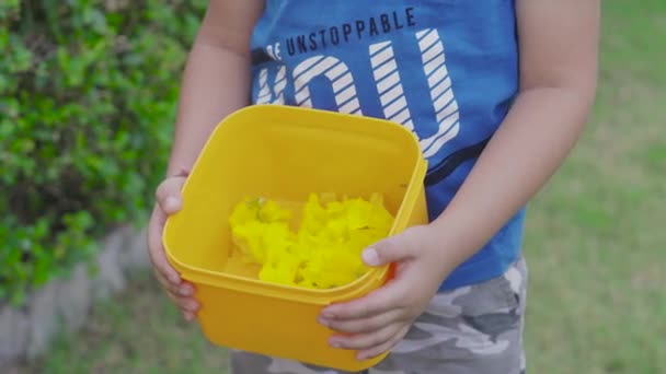 Indian Mother Collecting Yellow Flowers Her Cute Son Young Child — Stock videók