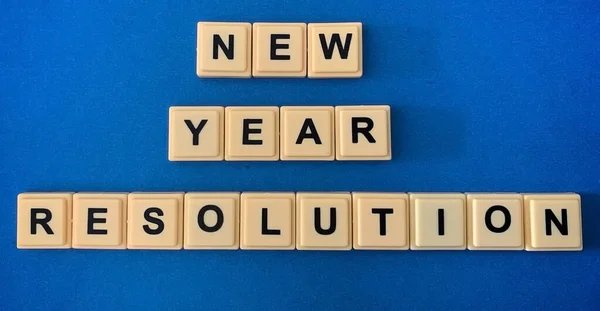 Words NEW YEAR RESOLUTION on cube blocks representing a new beginning — Fotografia de Stock