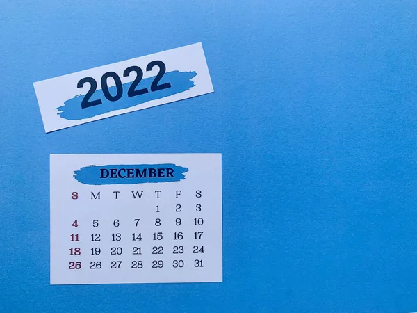 December 2022 white calendar with blue background. 2022 new year concept — Stock Photo, Image