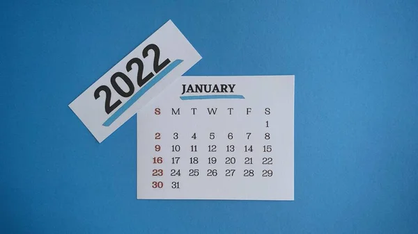White January 2022 calendar with blue background. 2022 New Year Concept — Zdjęcie stockowe